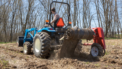 Tilmor Plastic Winder on Compact Tractor Tilmor Plastic Winder on Compact Tractor